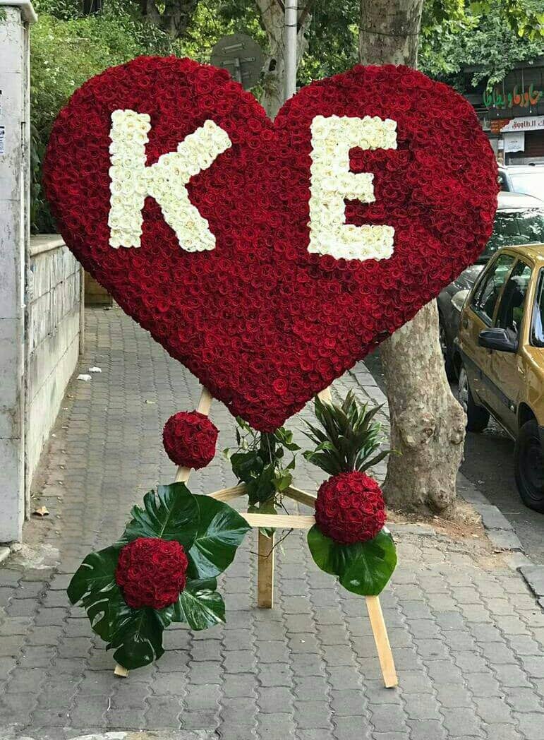 ستاند ورد قلب مع حرفين